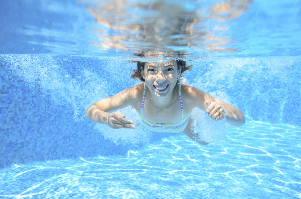 Girl Swimming Underwater - iStock_000059442312_Medium