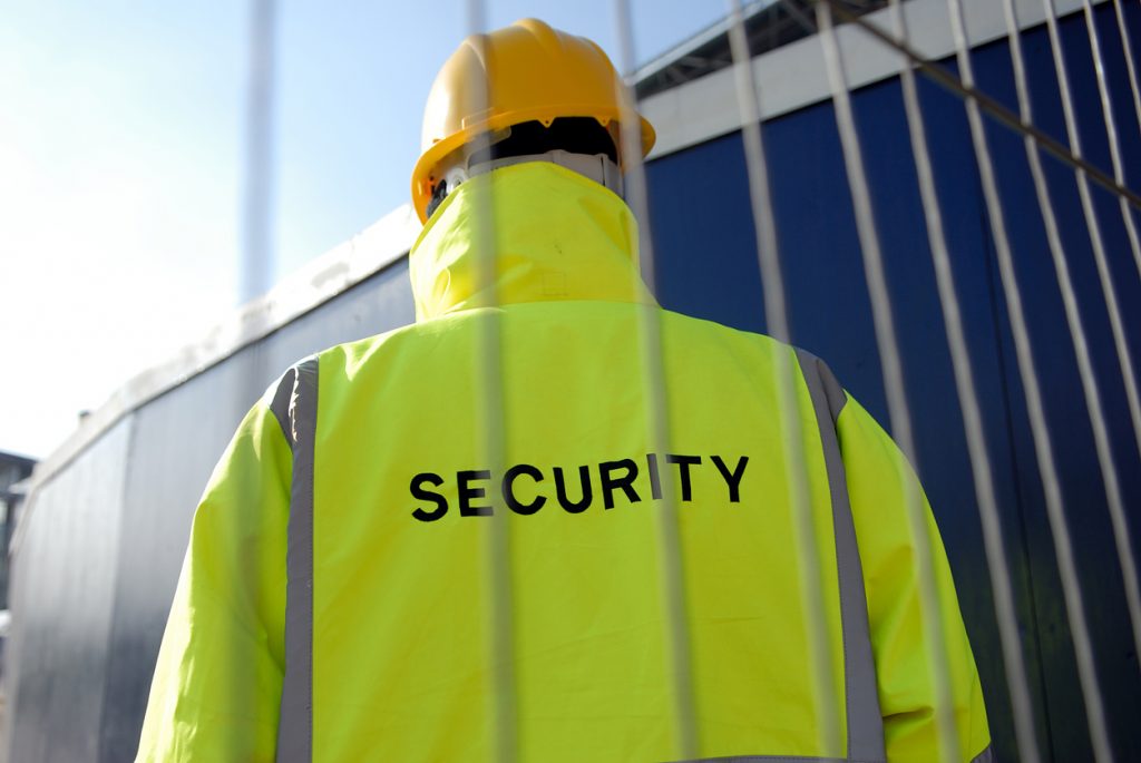Security guard wearing high-visibility jacket